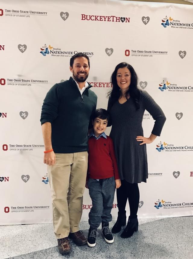 Hayden and his parents enjoying a BuckeyeThon event