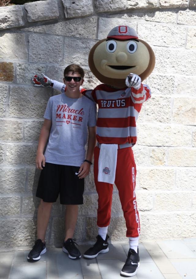 Josh laughing and posing with Brutus.