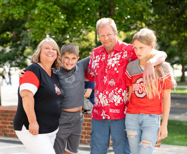 The Reeve's Family wearing Ohio State gear in front of the South Oval