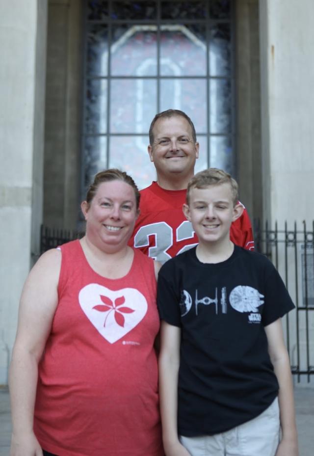 Sean getting a family photo with his parents at The Shoe.